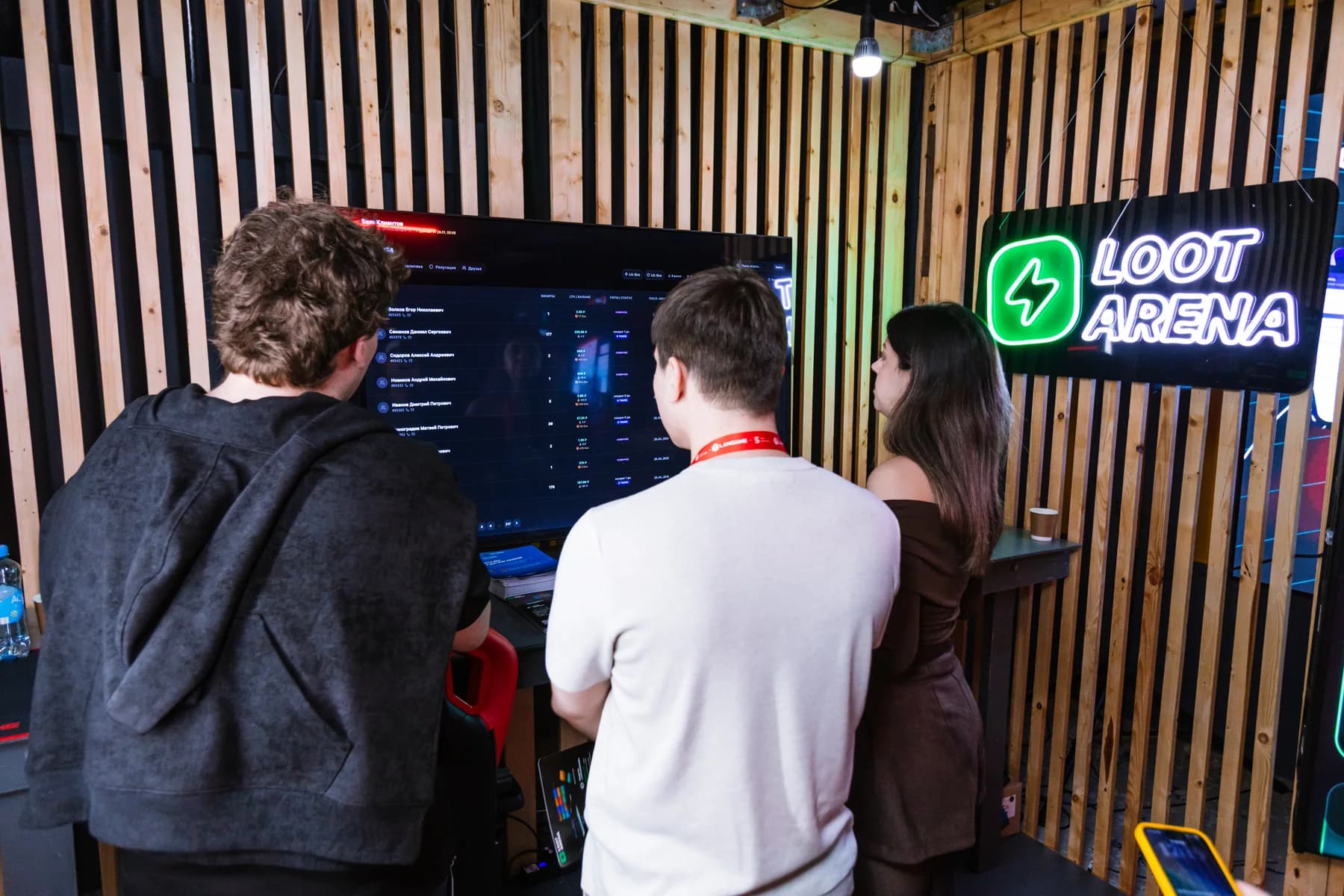 Guests discuss Loot Arena venue workflows at the ERP screen